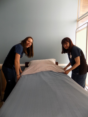 Personal Support Worker students learning to properly make a bed